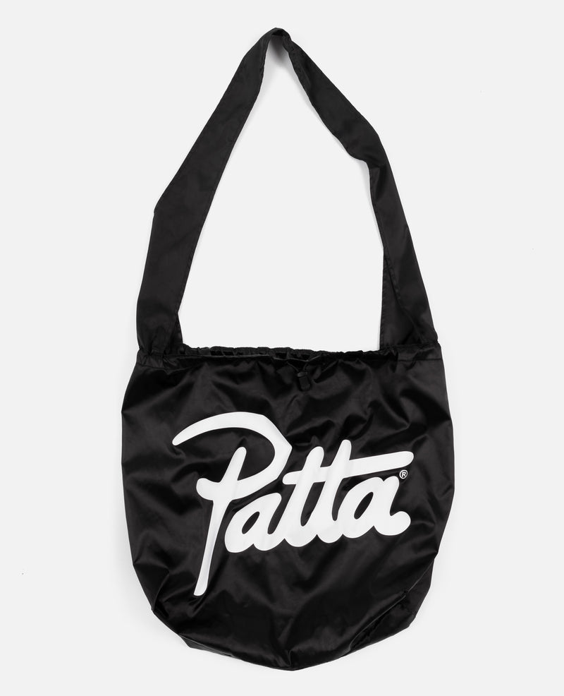 Black Patta tote bag with adjustable cord and a large patta logo