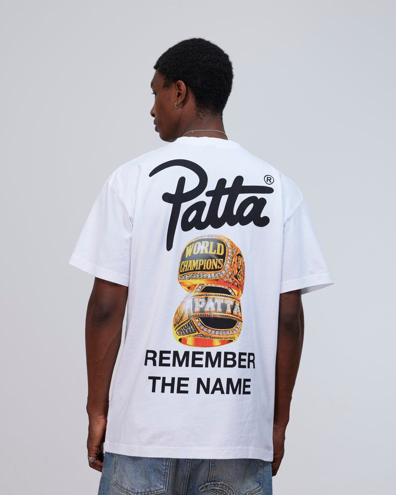 Back view of a model wearing the white Patta Championship T-Shirt with championship rings graphic.