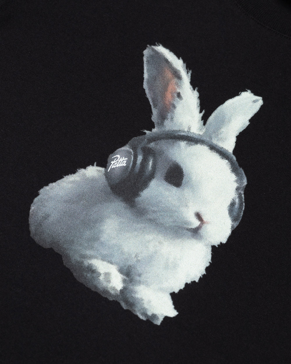 Detail of a white bunny wearing Patta headphones printed on a black kids t-shirt.