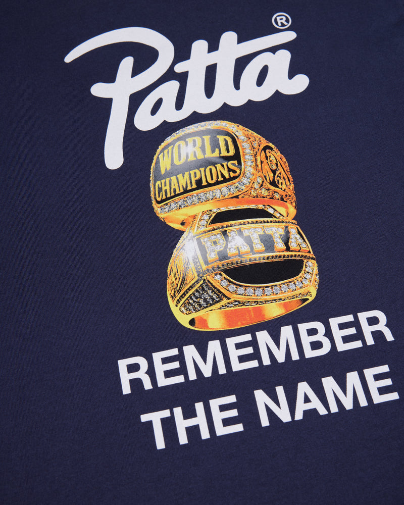 Championship rings graphic and Patta script logo print on the back of the Black Iris kids t-shirt.