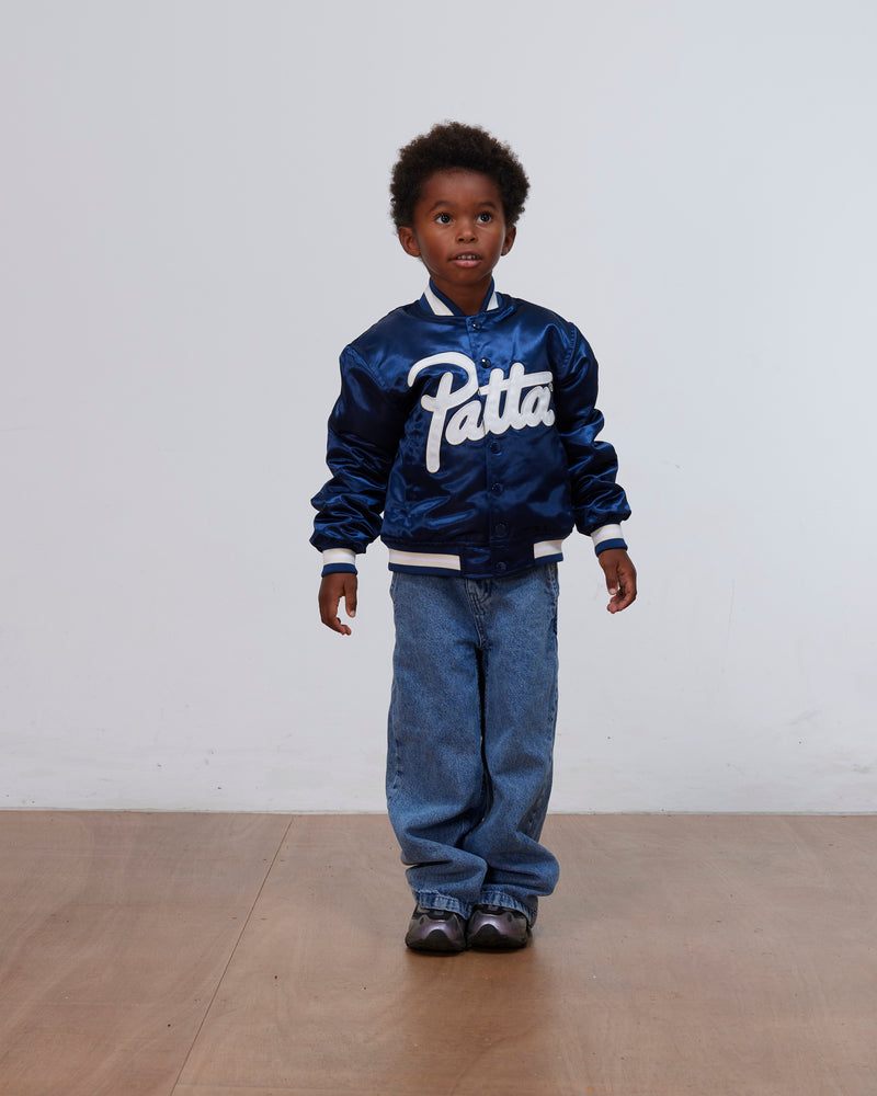 Patta Kids Satin Bomber Jacket in shiny Black Iris worn by a young model.